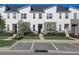 Modern townhouses with stone accents and neatly landscaped yards at 1842 Tropical Palms Cir, Kissimmee, FL 34747