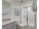 Clean bathroom with a walk-in shower and modern vanity at 1842 Tropical Palms Cir, Kissimmee, FL 34747