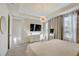 Bright bedroom with a large bed, dresser, and plenty of natural light at 1842 Tropical Palms Cir, Kissimmee, FL 34747