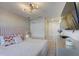 Spacious bedroom with a plush bed and large closet at 1842 Tropical Palms Cir, Kissimmee, FL 34747