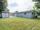 House exterior showcasing a gray painted side and backyard at 1721 Bellgrove St, Lakeland, FL 33805