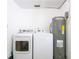 Laundry room with washer, dryer and hot water heater at 1721 Bellgrove St, Lakeland, FL 33805