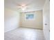 Bright bedroom with tile flooring and ceiling fan at 1721 Bellgrove St, Lakeland, FL 33805
