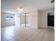 Bright bedroom with tile floors and mirrored closet doors at 1721 Bellgrove St, Lakeland, FL 33805