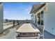 Outdoor dining area on a large balcony, offering scenic views at 7770 Sandy Ridge Dr # 201, Reunion, FL 34747