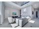 Bright living room with high ceilings, modern furniture, and large windows at 7770 Sandy Ridge Dr # 201, Reunion, FL 34747