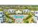 Aerial view of community pool and surrounding townhomes at 7770 Sandy Ridge Dr # 201, Reunion, FL 34747