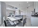 Bright dining area with a large table and modern chairs at 7770 Sandy Ridge Dr # 201, Reunion, FL 34747