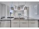 Modern kitchen with double sink and view of living room at 7770 Sandy Ridge Dr # 201, Reunion, FL 34747