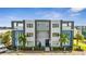 Modern building exterior with balconies and parking at 7770 Sandy Ridge Dr # 201, Reunion, FL 34747