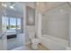 Modern bathroom with shower, bathtub, and toilet at 7770 Sandy Ridge Dr # 201, Reunion, FL 34747
