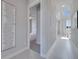 Bright hallway with access to bedrooms and living spaces at 7770 Sandy Ridge Dr # 201, Reunion, FL 34747