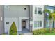 Modern building exterior with entrance and landscaping at 7770 Sandy Ridge Dr # 201, Reunion, FL 34747
