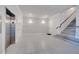 Modern entryway with elevator and stairs at 7770 Sandy Ridge Dr # 201, Reunion, FL 34747