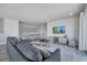Spacious game room with sectional sofa, pool table, and wall art at 7770 Sandy Ridge Dr # 201, Reunion, FL 34747
