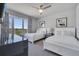 Spacious bedroom with two twin beds, ample closet space, and large windows at 7770 Sandy Ridge Dr # 201, Reunion, FL 34747