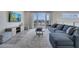 Modern living room with comfortable seating and access to a balcony at 7770 Sandy Ridge Dr # 201, Reunion, FL 34747