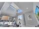 Open concept living room with high ceilings and adjacent kitchen at 7770 Sandy Ridge Dr # 201, Reunion, FL 34747
