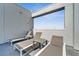 Private balcony features comfortable lounge chairs for relaxation at 7770 Sandy Ridge Dr # 201, Reunion, FL 34747