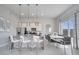 Modern kitchen with stainless steel appliances and dining area at 7770 Sandy Ridge Dr # 201, Reunion, FL 34747