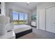 Bright bedroom with a queen-size bed and a view at 7770 Sandy Ridge Dr # 201, Reunion, FL 34747