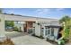 Modern building exterior with courtyard and seating at 7770 Sandy Ridge Dr # 201, Reunion, FL 34747