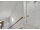 Clean stairwell with modern handrail and lighting at 7770 Sandy Ridge Dr # 201, Reunion, FL 34747