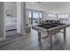 Game room features a pool table, comfortable seating, and access to a bedroom at 7770 Sandy Ridge Dr # 201, Reunion, FL 34747