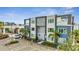 Modern building exterior with balconies and parking at 7770 Sandy Ridge Dr # 201, Reunion, FL 34747