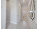 Bright entryway with tile floors and modern art at 7770 Sandy Ridge Dr # 201, Reunion, FL 34747