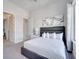 Spacious bedroom with a king-size bed and large windows at 7770 Sandy Ridge Dr # 201, Reunion, FL 34747