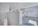 Bright loft area with wood-look floors and open railing overlooking the main floor at 7770 Sandy Ridge Dr # 201, Reunion, FL 34747