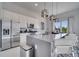 Modern kitchen with stainless steel appliances and an island at 7770 Sandy Ridge Dr # 201, Reunion, FL 34747