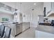 Modern kitchen with island, stainless steel appliances, and breakfast bar at 7770 Sandy Ridge Dr # 201, Reunion, FL 34747