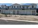 Modern townhome with gray and white exterior, two-car garage at 1782 Tila St, Kissimmee, FL 34746