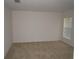 Spacious bedroom with carpeted floors and a window at 1928 Drum Dr, Kissimmee, FL 34759