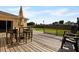 Wooden deck with seating and a view of the backyard at 526 Maricopa Dr, Kissimmee, FL 34758