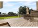 Relaxing backyard deck with seating area and view of the grassy backyard at 526 Maricopa Dr, Kissimmee, FL 34758