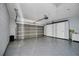 Attached garage with epoxy flooring and extra storage at 526 Maricopa Dr, Kissimmee, FL 34758