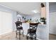 Breakfast bar with seating for two, offering a convenient kitchen space at 526 Maricopa Dr, Kissimmee, FL 34758