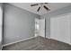 Spacious bedroom with carpet, neutral walls, and a double door closet at 526 Maricopa Dr, Kissimmee, FL 34758