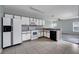 Clean kitchen with white appliances and light-colored cabinets at 526 Maricopa Dr, Kissimmee, FL 34758