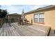 Backyard deck with table, chairs, and access to the house at 526 Maricopa Dr, Kissimmee, FL 34758