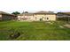 Spacious backyard with well-maintained lawn and walkway at 526 Maricopa Dr, Kissimmee, FL 34758