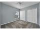 Well-lit bedroom with double door closet and ceiling fan at 526 Maricopa Dr, Kissimmee, FL 34758