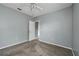 Spacious bedroom with door to bathroom and ceiling fan at 526 Maricopa Dr, Kissimmee, FL 34758