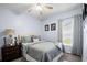 Bright bedroom with double bed, featuring a ceiling fan and window coverings at 526 Maricopa Dr, Kissimmee, FL 34758