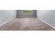 Empty bedroom with neutral walls and carpet, featuring a window at 816 William Way, Haines City, FL 33844