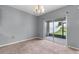 Bright dining room with sliding glass doors leading to backyard at 816 William Way, Haines City, FL 33844