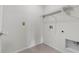 Clean laundry room with built-in shelving and space for washer and dryer at 816 William Way, Haines City, FL 33844